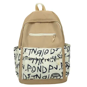Trendy khaki student backpack with large capacity and stylish graffiti letter print detail