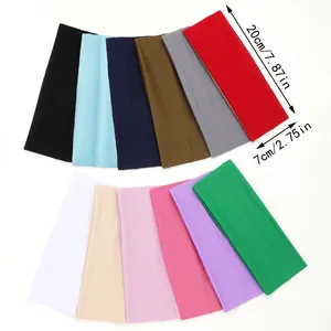 Detailed view of colorful 7cm wide elastic sports headbands with 20x7cm size markings