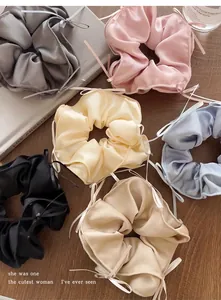 Collection of ballet-style satin scrunchies with elegant ribbon bow details