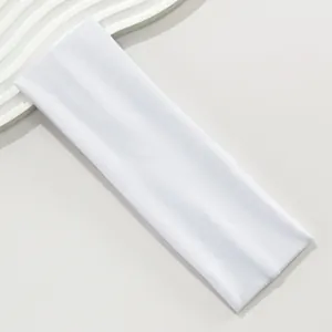 Close-up of white 7cm wide elastic sports headband showing breathable fabric texture