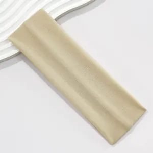 Detailed view of the khaki knitted wide elastic headband with high stretch fabric