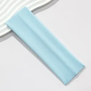 Detailed view of the premium light blue 7cm wide elastic sports headband for yoga