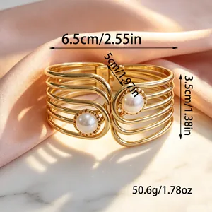 Gold-tone geometric cuff bracelet with pearls and detailed size measurements.