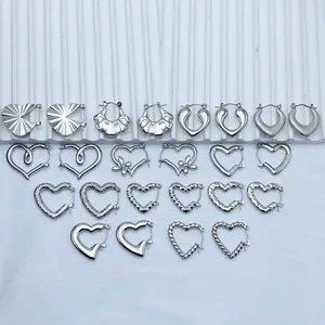 Detailed selection of heart-shaped stainless steel hoop earrings in polished silver finish