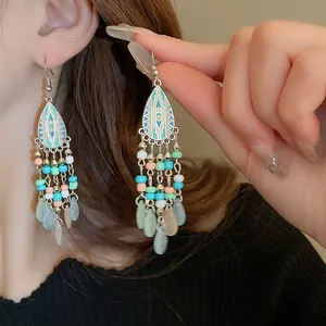 Close-up detail of Bohemian ethnic style tassel earrings with colorful beads