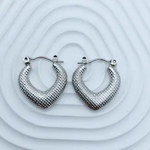 Elegant silver-toned heart-shaped hoop earrings with detailed textured lattice surface