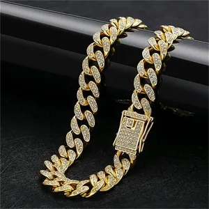 Close-up of golden hip-hop Cuban link necklace with sparkling full rhinestone inlay