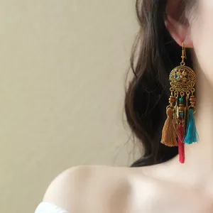 Elegant Bohemian style long hook earrings with colorful tassels and feather charms
