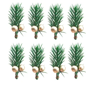 Close-up of eight artificial pine needle picks with gold berries for Christmas decor