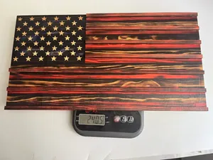 Rustic wooden American flag wall decor being weighed on a digital scale showing 240.5 grams