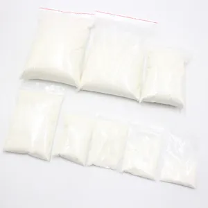 Multiple transparent bags filled with white artificial snow powder for Christmas decor