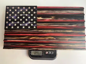 Macro view showing the wooden American flag box weight of 296.8g on a scale