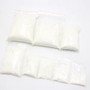 Detailed macro view showing white artificial snow powder inside clear plastic zip-lock bags.