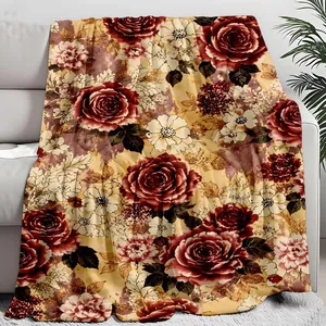 Detail of soft flannel throw blanket featuring a vintage red and white rose floral pattern.