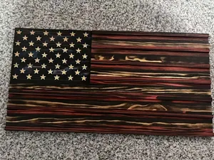 Detailed view of handcrafted rustic wooden US flag wall art with charred textures