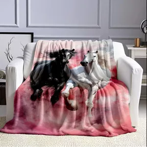 Soft plush sofa blanket featuring a running horse print in a modern living room decor