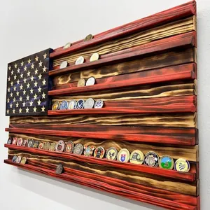 Detailed view of wooden American flag coin display rack with challenge coins