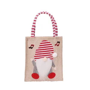 Mooie Kerstkabouter cadeautas van jute met rood gestreepte muts en witte baard