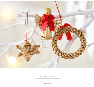 Close-up of handmade straw Christmas ornaments including angel, star, and wreath
