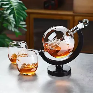 Detailed close-up showing the etched world map on the globe decanter and internal ship