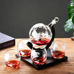 Elegant globe whiskey decanter set with etched map glasses and glass sailing boat