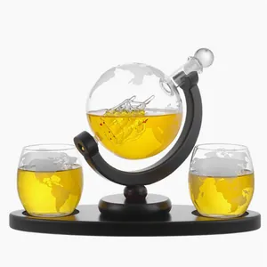 Elegant globe whiskey decanter set with etched world map and glass ship inside