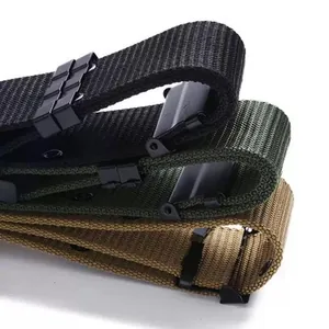 Macro view showing the texture and buckle of black, green, and khaki tactical canvas belts.