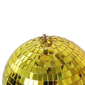 Macro detail of golden disco mirror ball with metal hanging ring for parties