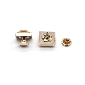 Macro view of 10mm square zinc alloy rhinestoned rivets showing various components