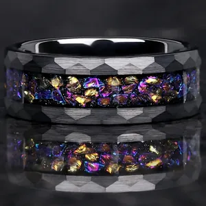 Detailed macro view of a faceted stainless steel ring featuring vibrant colorful inlay