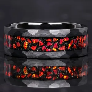 Faceted black stainless steel ring with crushed red opal inlay and reflective finish