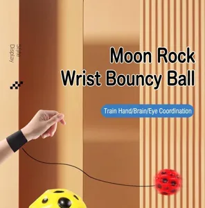 Detailed view of children's wrist bouncy ball showing the elastic cord attachment