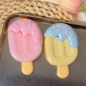 Close-up of cute ice cream shaped squishy stress relief toy set on a metal tray