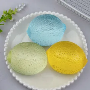 Close-up of colorful lemon stress relief toys with realistic skin texture on a plate.