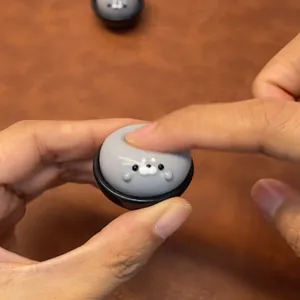 Close-up detail of a soft grey seal squishy toy being pressed for stress relief