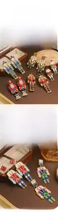 Detail of colorful rhinestone dripping oil nutcracker soldier dangle earrings for women.