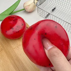 Close-up of watermelon smoothie squishy stress relief toy showing its soft and moldable texture