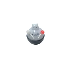Adorable white seal squishy toy holding colorful lollipops for stress relief decoration