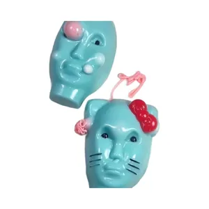 Jouet à presser visage d'alien et nœud de chat surréaliste en bleu cyan brillant