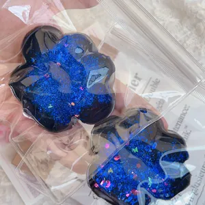 Blue starry cat paw squishy toy with sparkling glitter texture for sensory stress relief