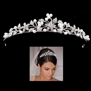 Elegant silver bridal tiara adorned with sparkling rhinestones and white pearls.