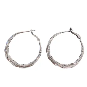 Elegant twisted silver-plated hoop earrings with a high-polished finish for women