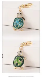Close-up of cute turtle rhinestone keychains with gold plating and sparkling gems