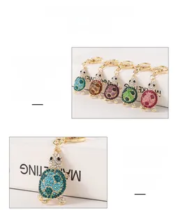 Macro detail of cute turtle keychains with vibrant sparkling rhinestone crystal embellishments.