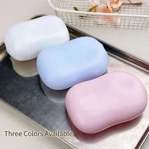 Detailed view of three colorful moldable soap-shaped squeeze toys for stress relief