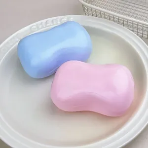 Detail view of pink and blue soap-shaped squishy stress relief toys on a plate