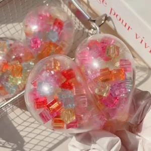 Detailed close-up of a heart-shaped squishy toy with colorful translucent ice cube fillers