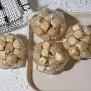 Close-up of creative wooden sensory balls in transparent shell for stress relief.