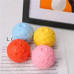 Detailed view of four colorful textured moon-shaped stress relief squeeze toys