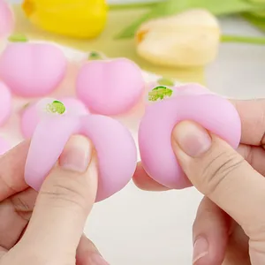 Soft pink peach squishy toy for stress relief featuring a cute and realistic design
